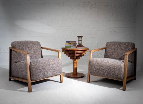 Stylishly compact mid-century armchair made of wood and upholstered fabric