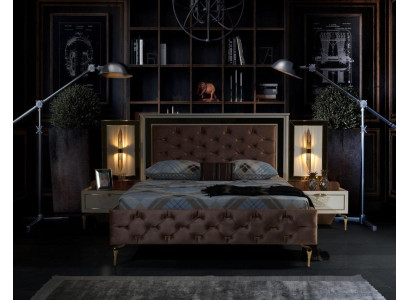 Elegant Chesterfield comfort bed with gold legs and matching bedside tables