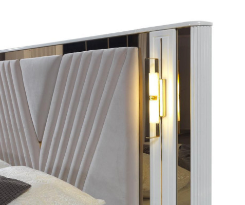 2-bedroom bed with gold trim and matching bedside tables