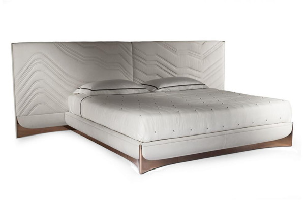 Elegant double bed. Luxurious bedroom bed. Stylish bed