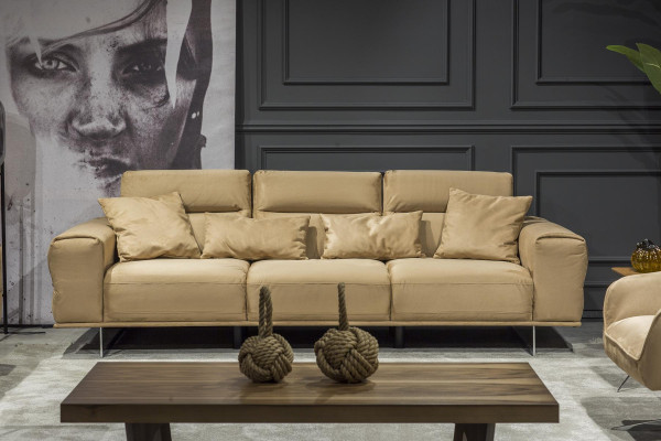 Luxurious Italian cream three-seater sofa with lush cushions