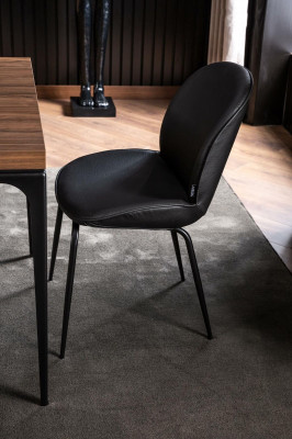 Laconic black chair in a modern design for the dining room