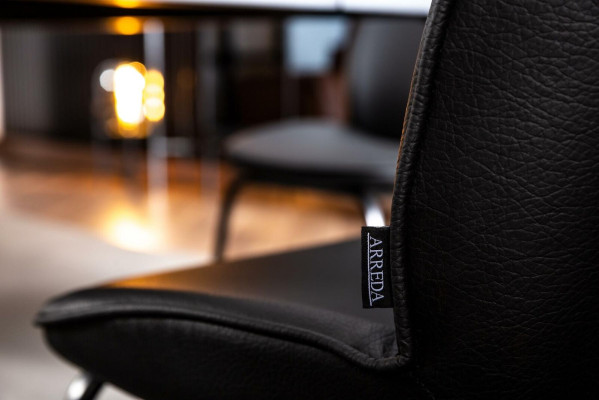 Laconic black chair in a modern design for the dining room
