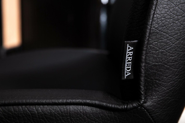 Laconic black chair in a modern design for the dining room