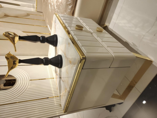 Luxurious bedroom furniture set: bed, 2 bedside tables and wardrobe