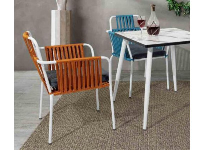 Original light color chair on white stainless steel legs and a soft seat cushion