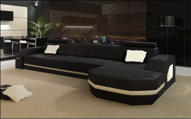 Elegant black corner sofa in L-shape. Stylish furniture for your home