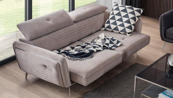 Luxurious, fashionable two-seater sofa with textile upholstery on high legs
