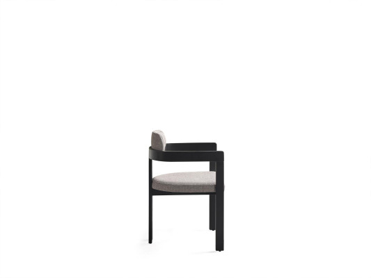 An ultra-modern chair with an unusual shape and interesting legs with a comfortable backrest in gray-black for the dining room