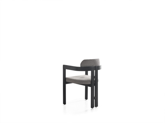 An ultra-modern chair with an unusual shape and interesting legs with a comfortable backrest in gray-black for the dining room