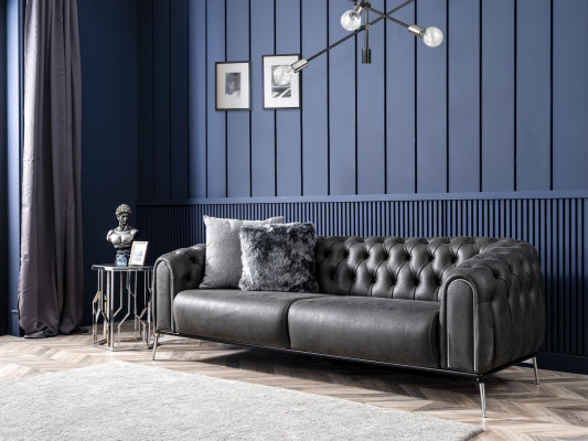 Black Chesterfield style four-seater straight sofa for the living room