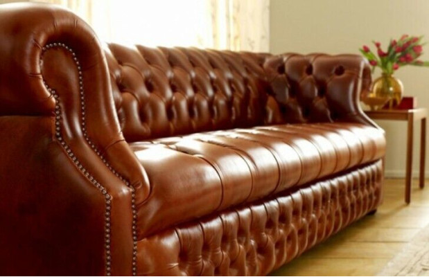 Brown Chesterfield three-seater designer 3-seater sofa. Stylish couch