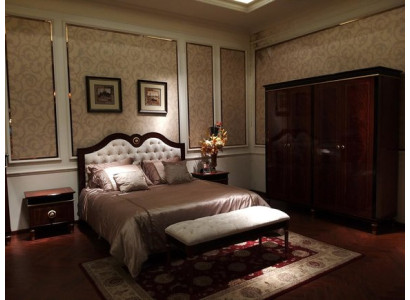Royal bedroom ensemble with double bed and bedside tables