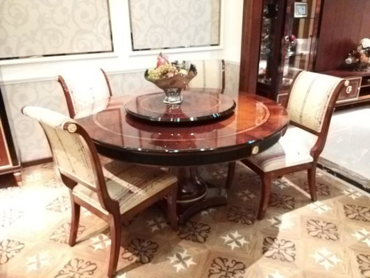 Beautiful round dining table made of natural wood with 4 chairs