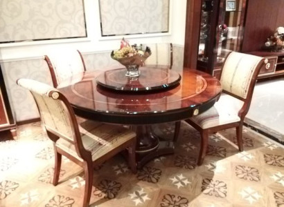 Beautiful round dining table made of natural wood with 4 chairs