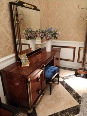 Elegant polished dressing table with mirror and comfortable stool