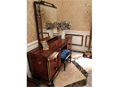 Elegant polished dressing table with mirror and comfortable stool