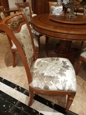 Designer chair made of solid wood with luxurious upholstery from European furniture manufacturers