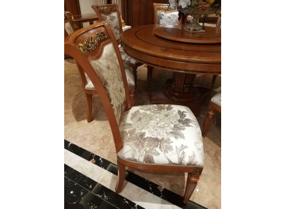 Designer chair made of solid wood with luxurious upholstery from European furniture manufacturers