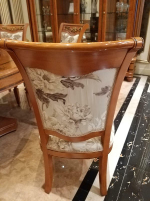 Designer chair made of solid wood with luxurious upholstery from European furniture manufacturers