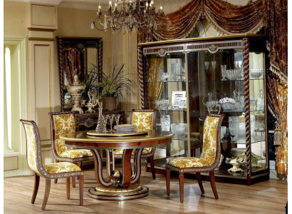 Classic r dining table in a round shape with an artistically decorated base